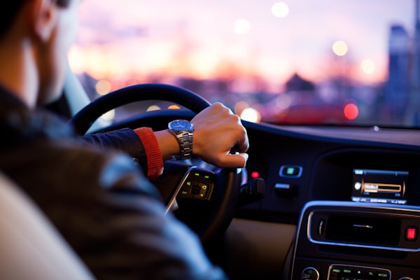 A man driving and talking on call